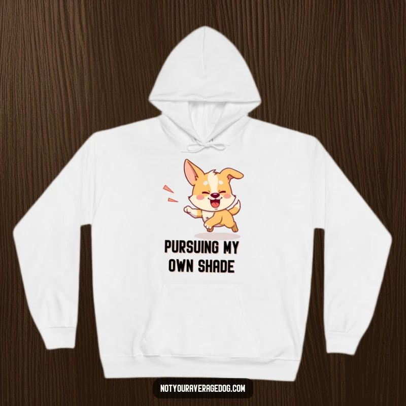 Funny chasing shadow dog hoodie, a silly dog with intense determination, enthusiastically running after its shadow.