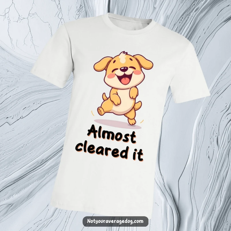Funny t-shirt featuring a dog enthusiastically failing a simple jump with a comical expression.